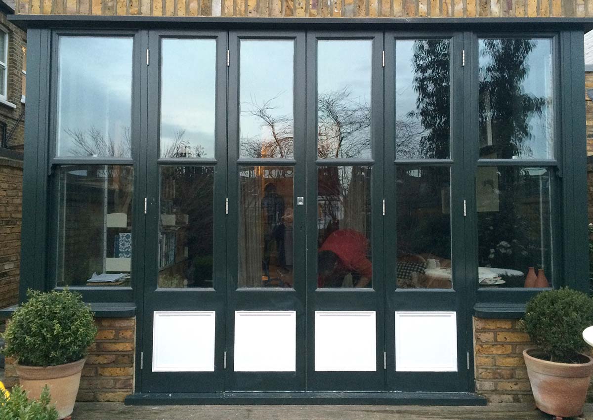 slim double opening bi-fold doors with side panels, Muswell Hill