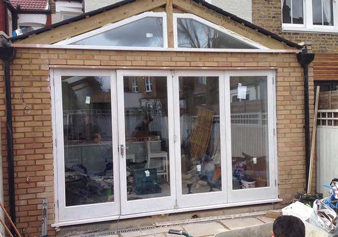 bi-fold doors with 4 leaves and fixed window lights above, NW1