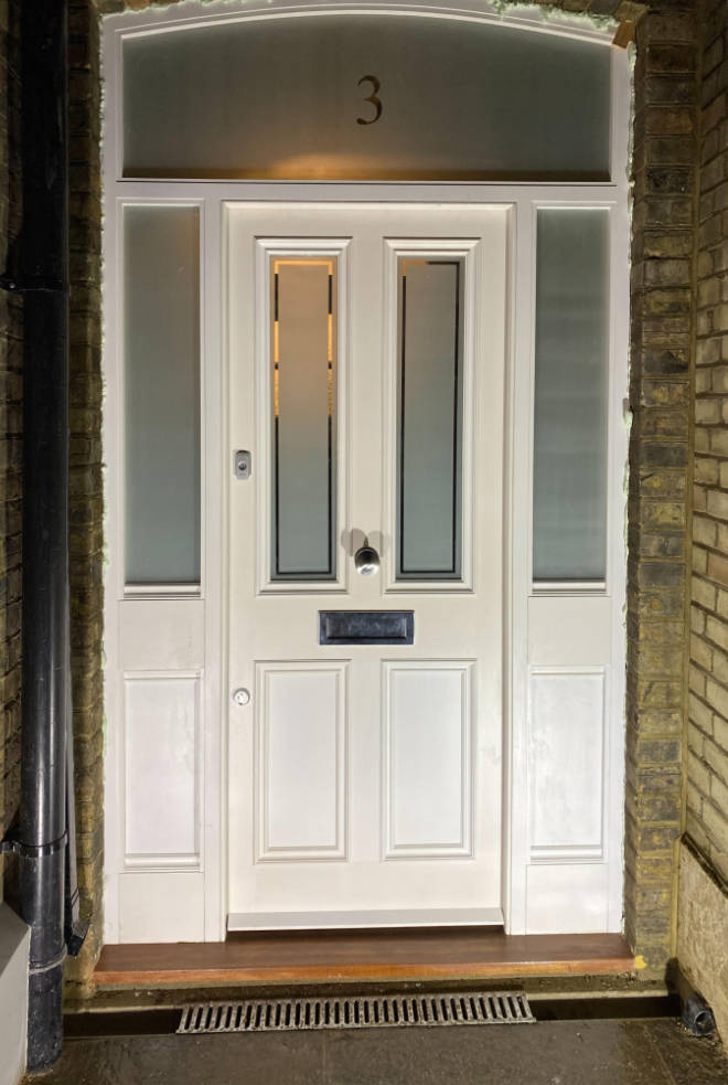 Solid front door with toughened safety glass containing clear decorative strip, Highgate