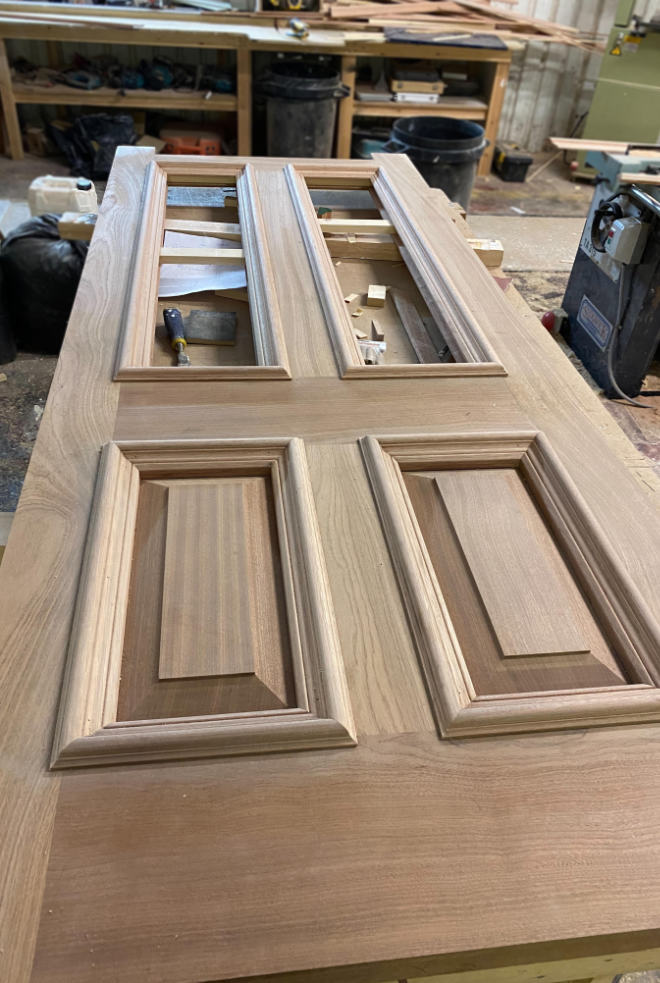 Hardwood panelled door being prepared in the workshop.